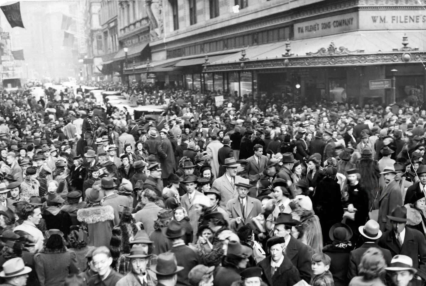 #14 The shopping crowd packs the intersection of Washington and Summer Streets in Boston, 1939.
