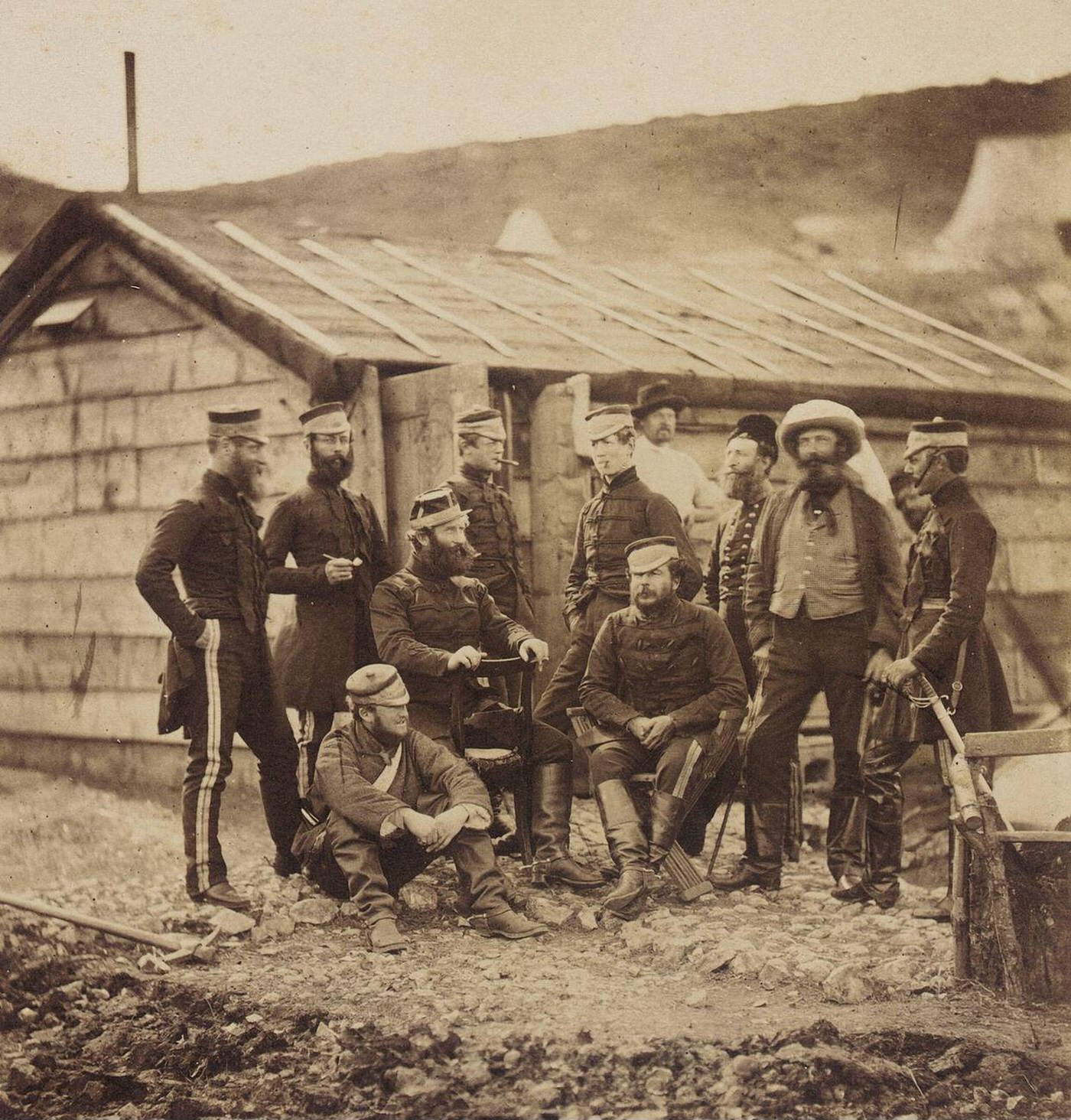 #29 Officers of the 4th Light Dragoons relaxing by a building during the Crimean War, 1855.