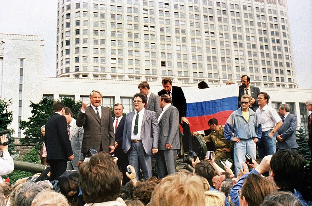 #22 Russian President Boris Yeltsin stands on an armored vehicle during a coup attempt, 1991.