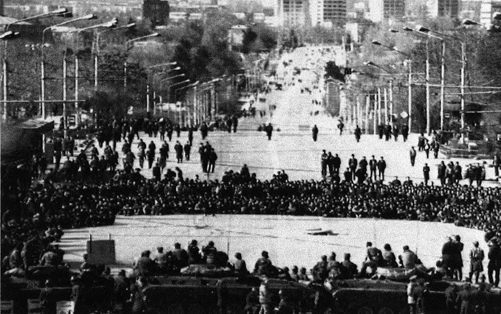 #7 Residents face Soviet troops in front of the Communist Party Headquarters in Dushanbe, Tajikistan, 1990.