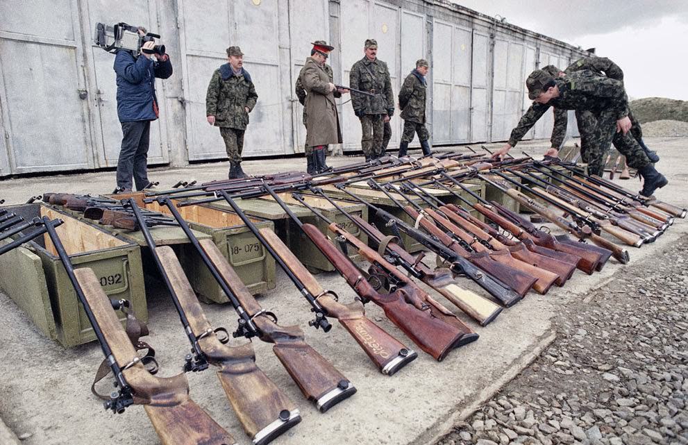 #8 Soviet paratroopers inspect weapons confiscated from a local militia in Kaunas, Lithuania, 1990.