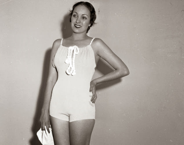 #19 Bathing suits were definitely more conservative back in 1935! Here, model Priscilla Lawson stands pretty in a rubber swimsuit.