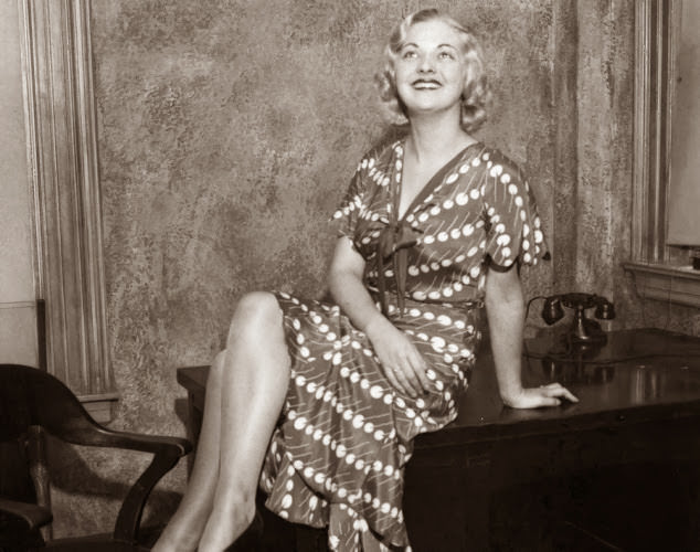 #24 Well-known fashion model Sandy Goodwin, who posed for the entrance plaques at Radio City, hams it up for photographers in 1932.
