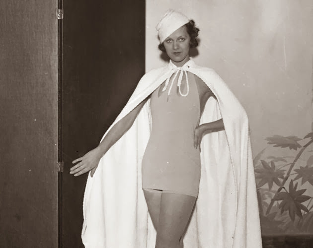 #4 This supermodel looks like Superwoman! Ruth Dodd models a Nantucket one-piece with a detachable skirt at a bathing suit show in 1933.