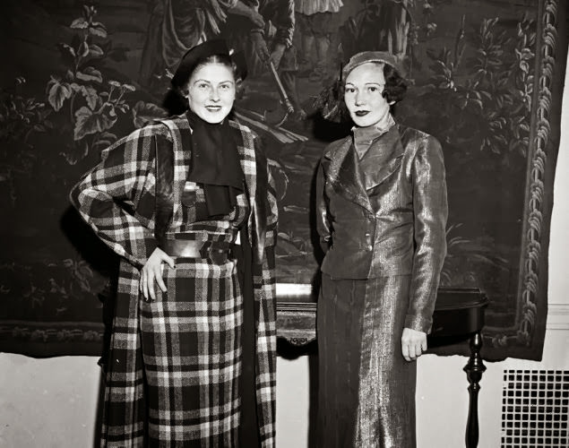 #6 Two models cover up in fashionable women’s suits at a 1933 show.