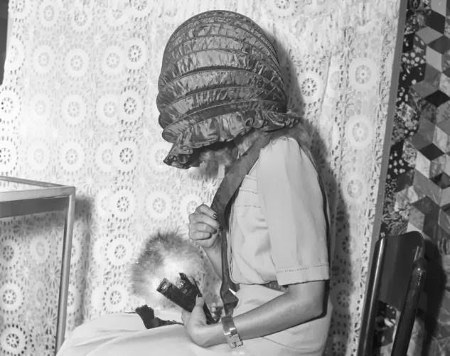 #15 We thought models liked to show off their beautiful faces, but apparently in 1941 the folding bonnet was all the rage.