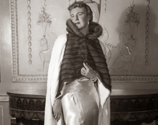 #16 Though wearing fur today is a bit of a taboo, back in the 1930s it was extremely common. Here, a model wears a white Russian ermine cape with a sable collar in a fur fashion show at the Waldorf-Astoria Hotel, 1935.