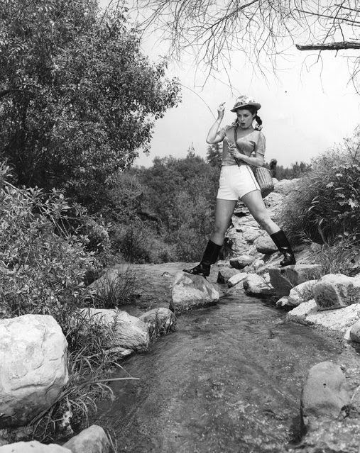 #14 Pat Alphin, a film actress catches a fish, 1935.