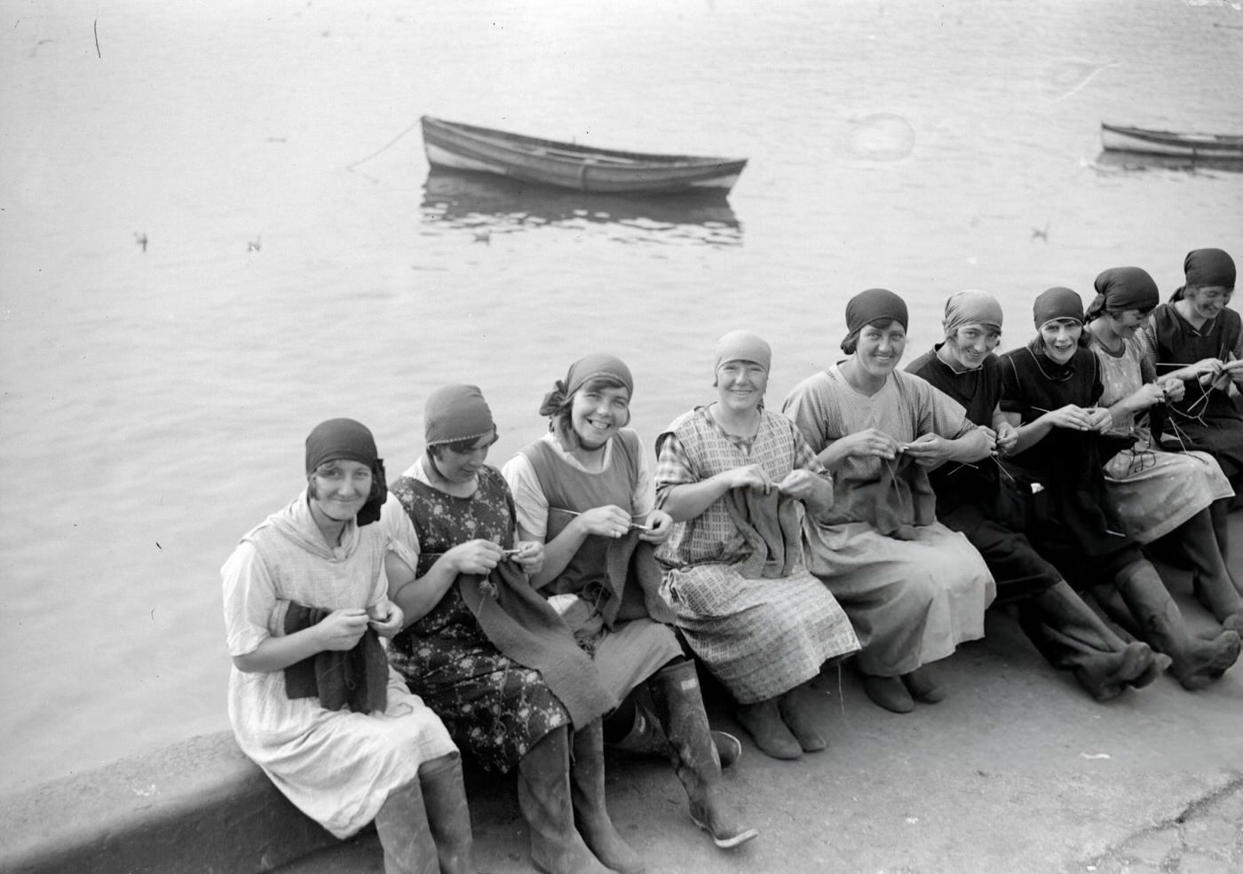 #39 Yarmouth fisher-girls knitting as they wait for the fishing boats to come in, 1929.