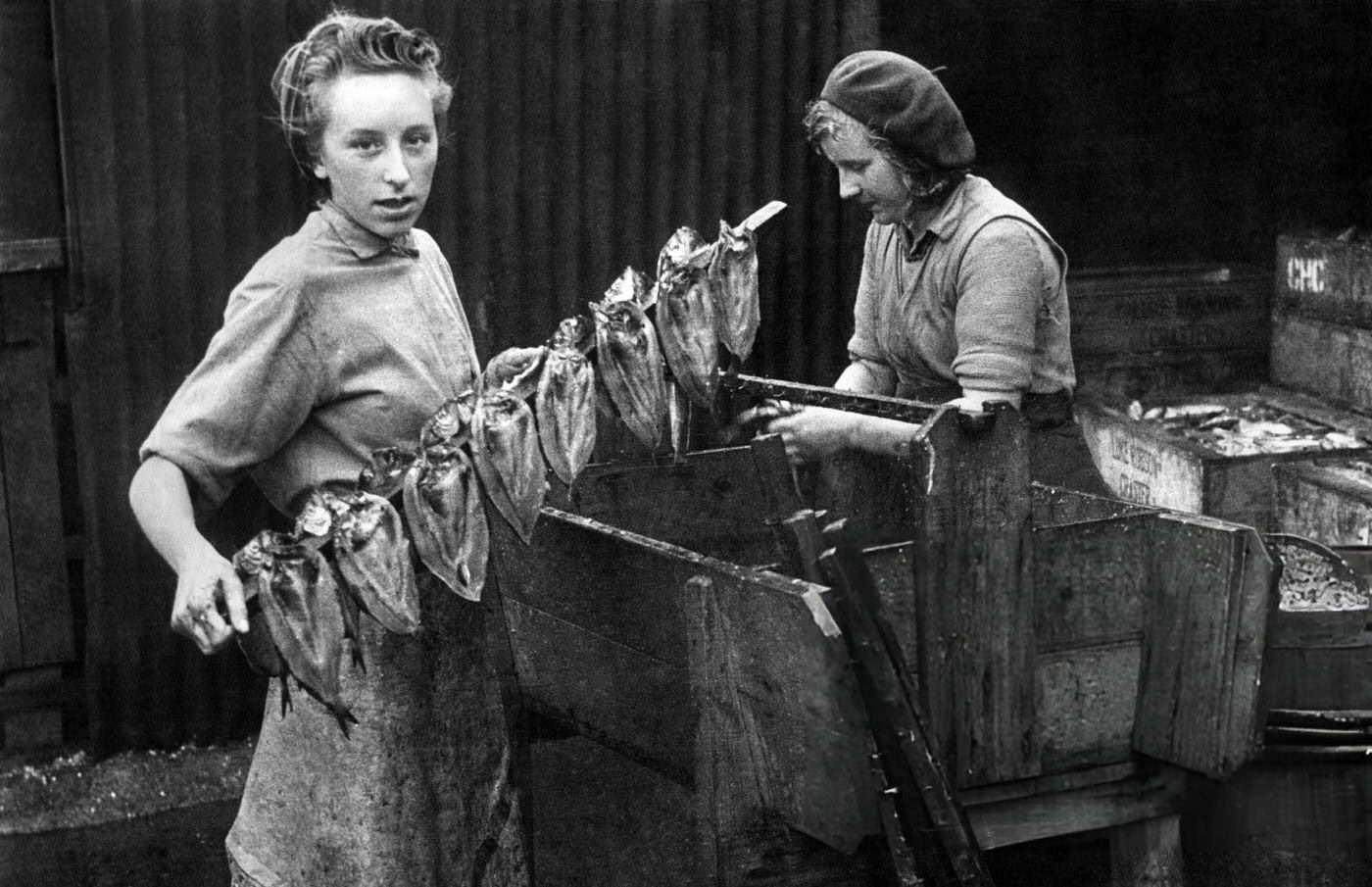 #58 Fisherwomen preparing herrings to be smoked, 1943.