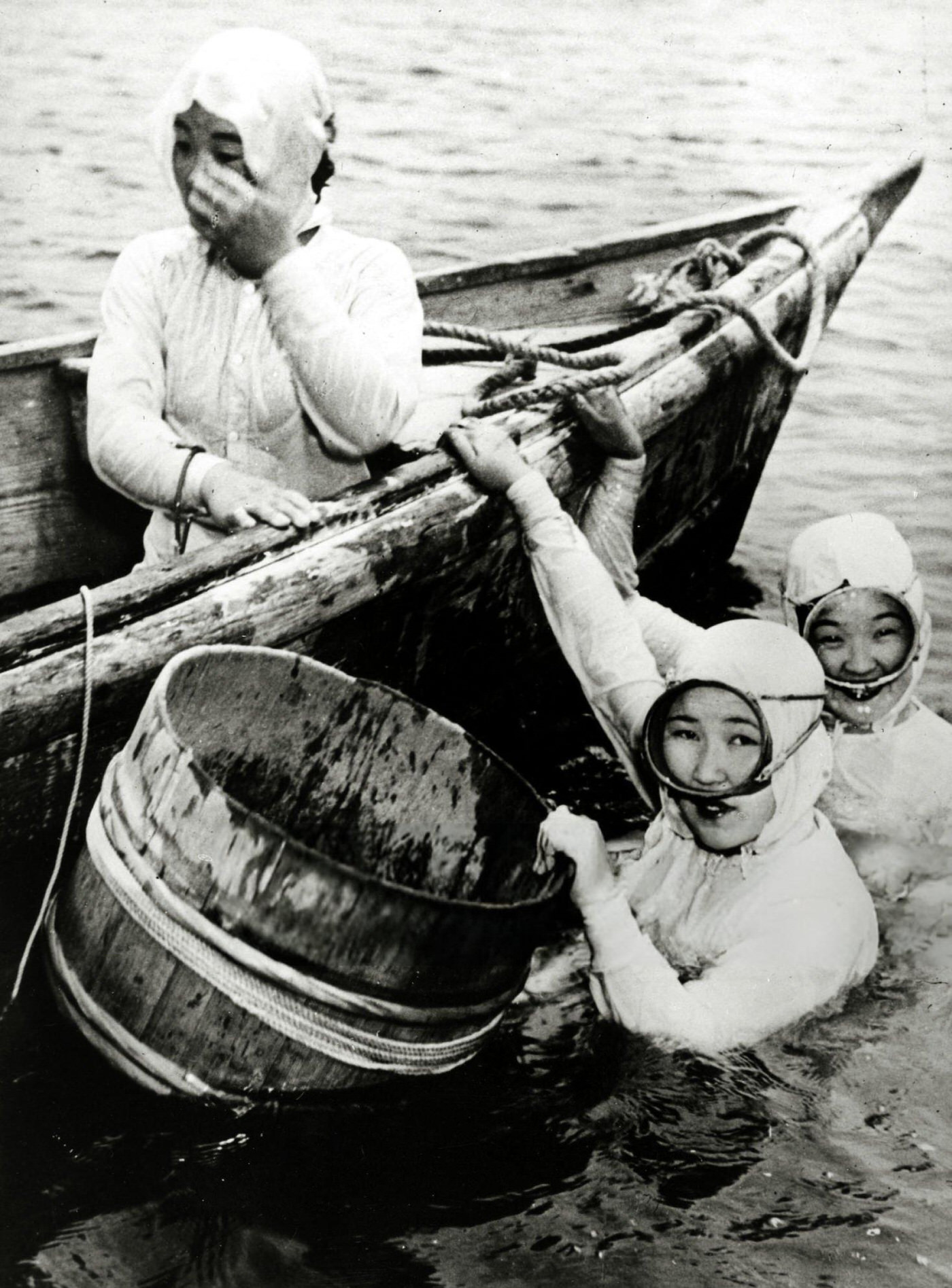 #60 Japanese girl divers collecting oysters from the sea and river estuaries, 1950.