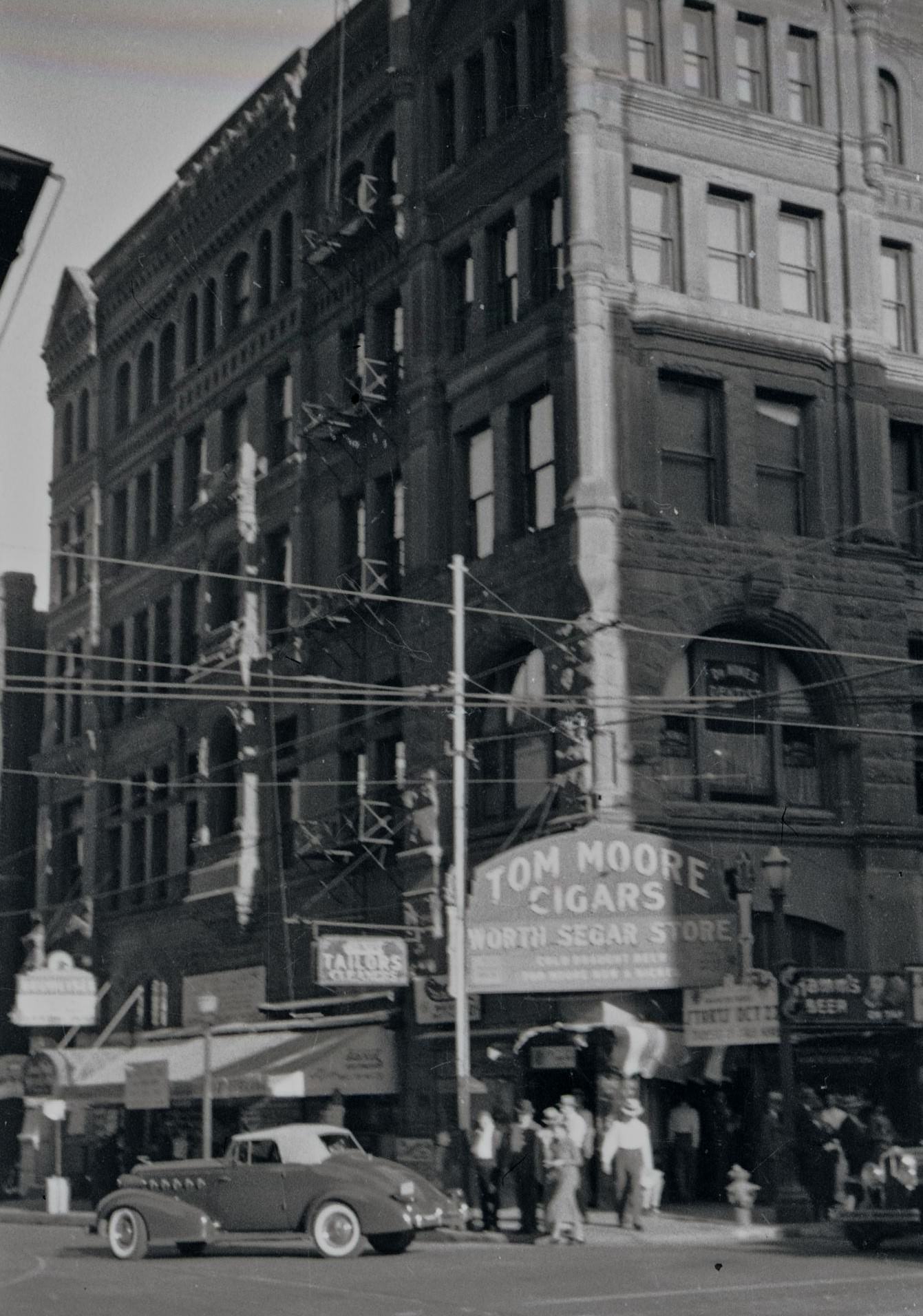 #98 Tom Moore Cigar’s storefront in Fort Worth, Texas, 1930s.