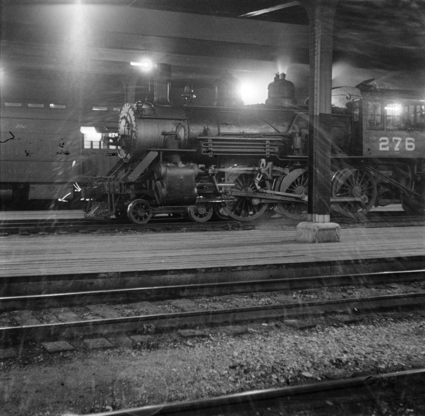 #19 A train engine at a train station in Fort Worth, Texas, 1930s.