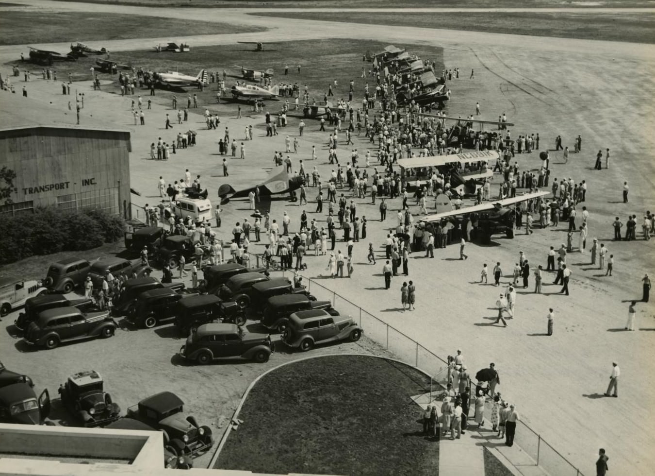 #112 Spectators watching parked planes at an airshow in Fort Worth, Texas, 1937.