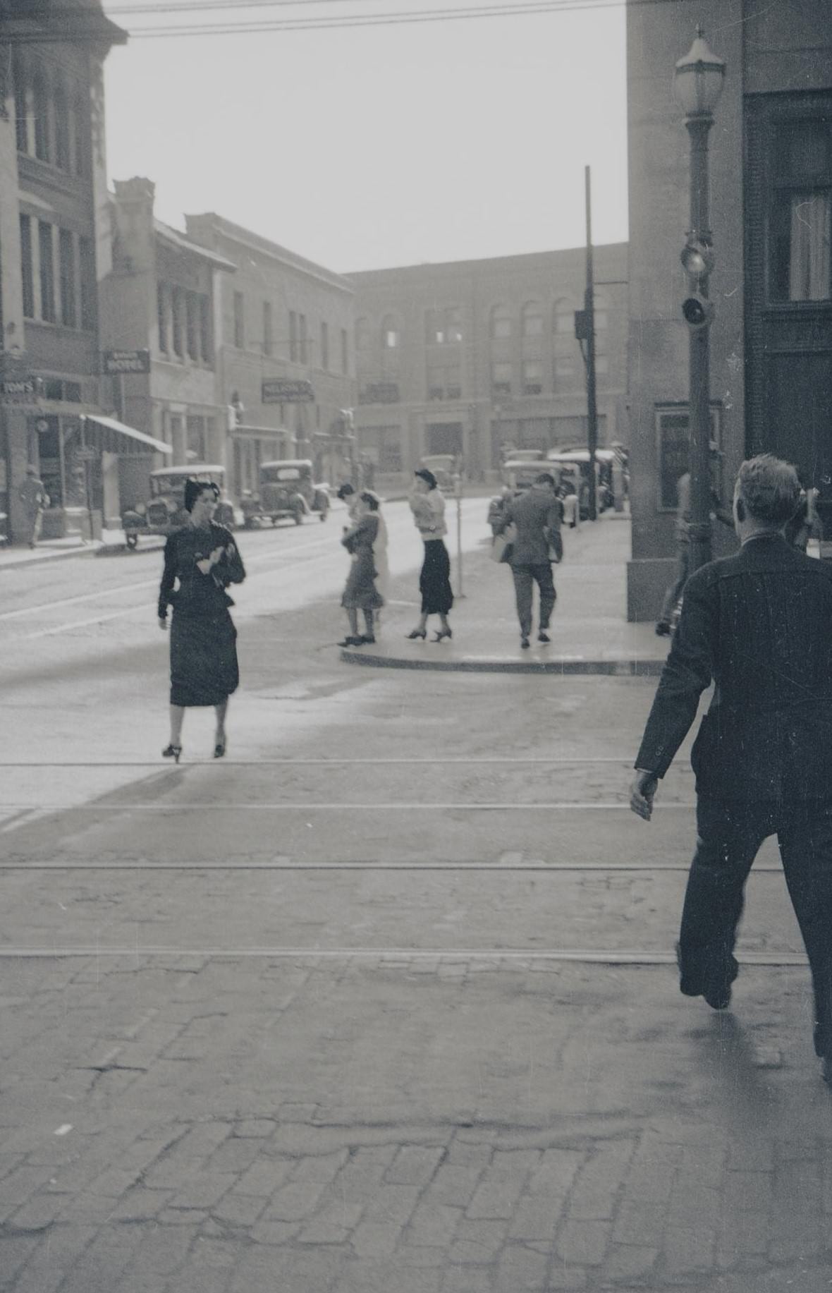 #66 Pedestrians walking and crossing an intersection in Fort Worth, Texas, 1930s.