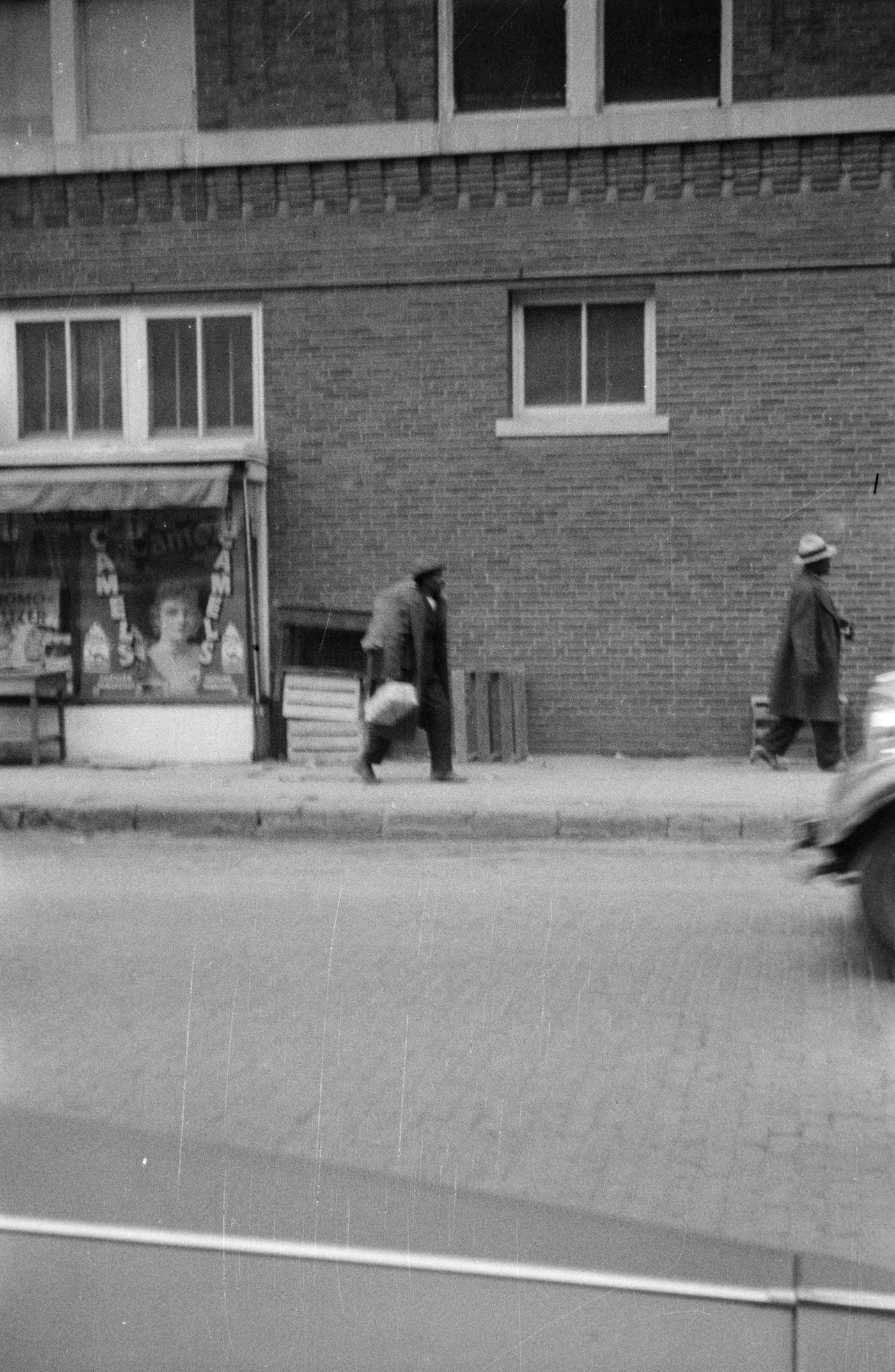 #71 Two men walking on a brick street in downtown Fort Worth, Texas, 1930.