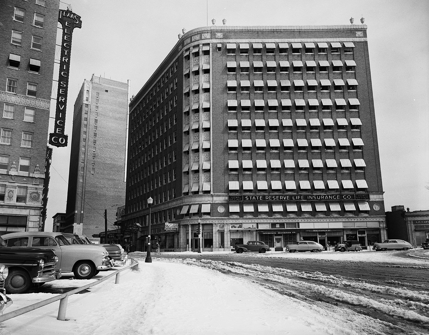 #100 Image shows the Neil P. Anderson Building at 7th and Lamar, offices of the State Reserve Life Insurance, 1951.