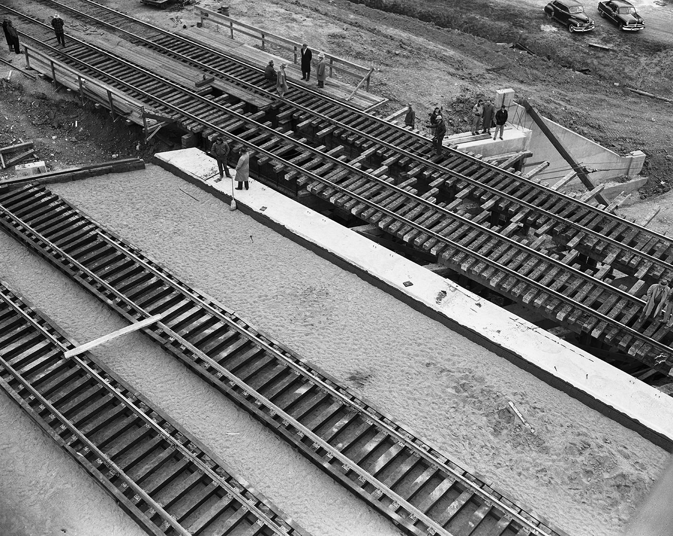#104 New steel platform being skidded under the Texas & Pacific Railway tracks in Trinity Park, 1950.