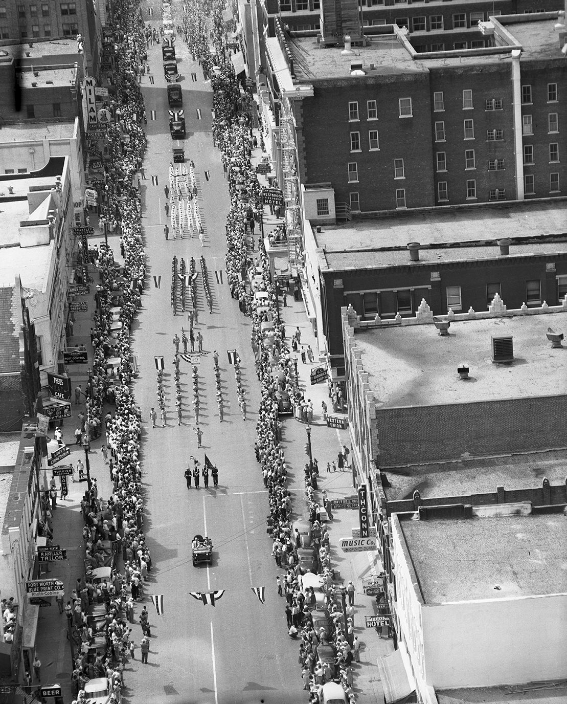 #72 Aerial view of street in downtown Fort Worth during the parade to welcome General Douglas MacArthur, 1951.