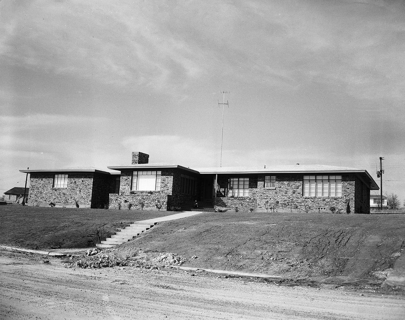 #95 The home of Thomas G. Rumph Jr., at 3680 Encanto Drive, with clinker brick walls and a crushed marble roof, 1951.