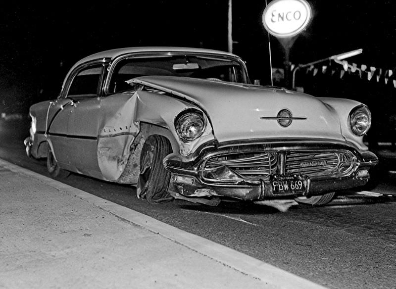 A 1956 Oldsmobile 4-door hardtop meets with disaster on the mean streets of Fresno, California, in the mid-1960s. Another old classic denied a chance to live out its golden years at future car shows