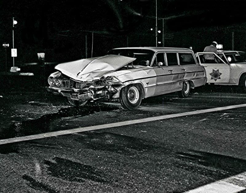 A 1964 Chevrolet wagon sold new by Frontier Chevrolet gets “customized” in an evening accident in Fresno, California, in the mid-1960s, The mis-matched color of the front end suggests this wagon had already been in wreck prior to his event