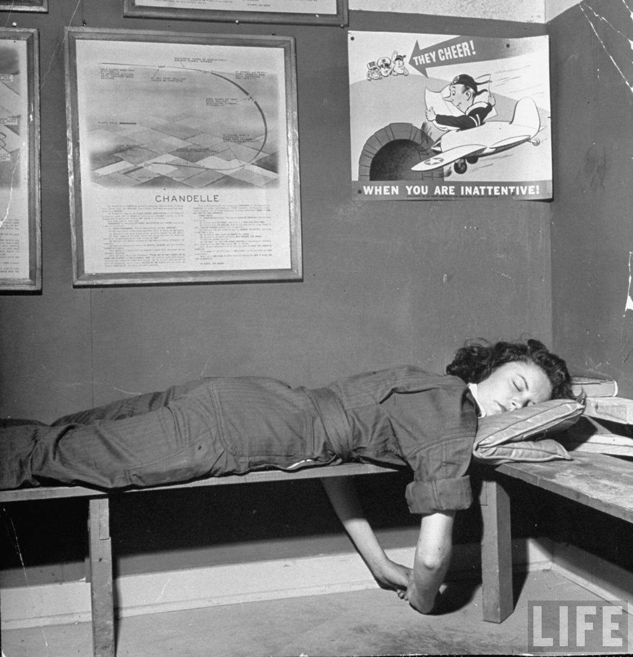 #8 Elaine Jones, pilot trainee in the Women’s Flying Training Detachment, sleeping on hard bench after flying until 3 a.m. the previous night, at Avenger Field.