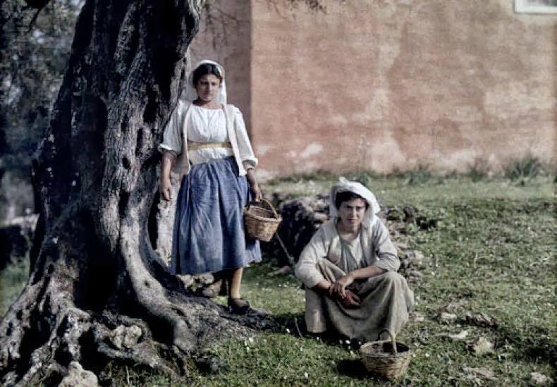 Two women with baskets used for gathering olives during harvest, Deka, Corfu.