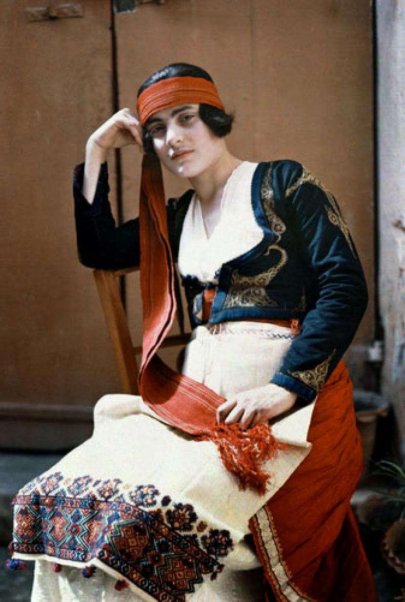 A maid of Candia poses in costume.