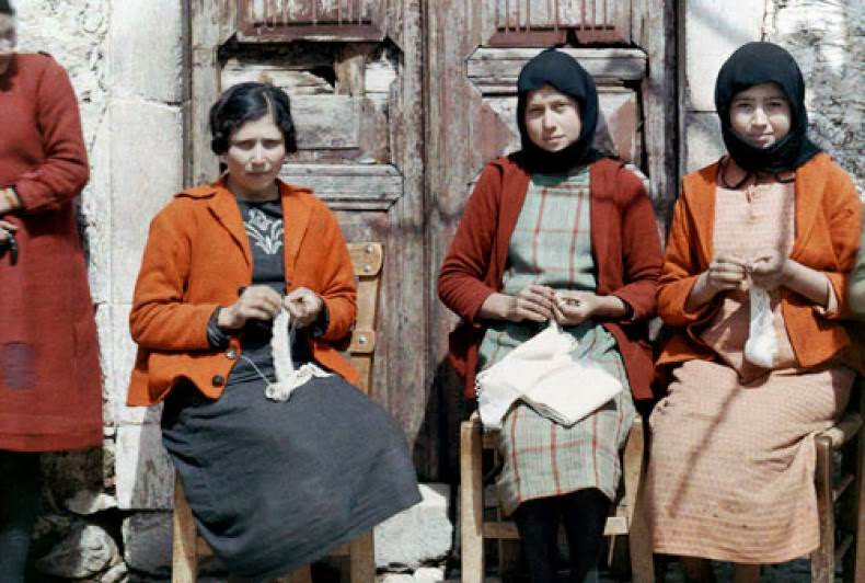 Three women sit and do needlework, Crete.