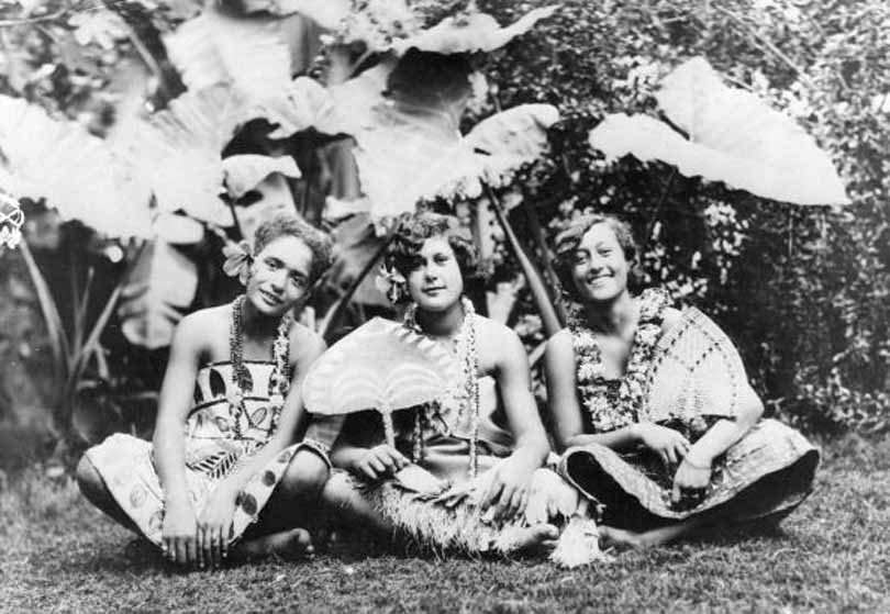 #78 A group of Hawaiian girls sit against a tropical background, 1932.