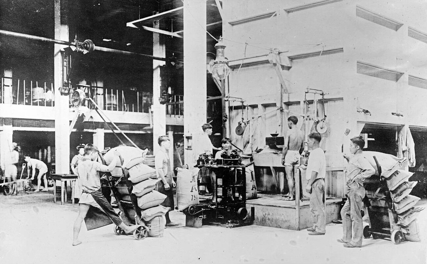 #34 Filling sacks of raw sugar at Plantation mill, Hawaiian Islands, 1910s.