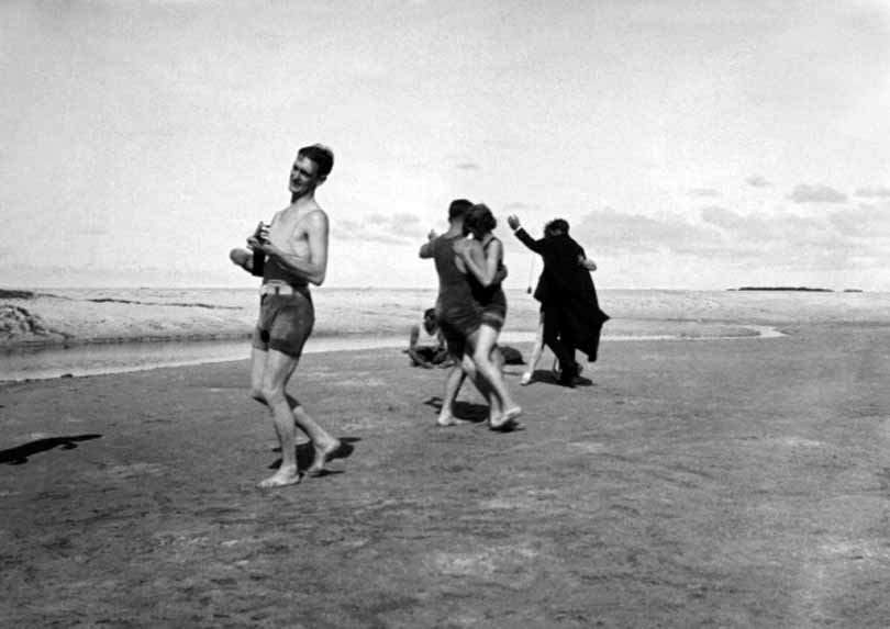 #85 Two couples dance on the beach in the early morning to the sounds of a ukulele at a Hawaiian Sunrise Soiree, 1920.