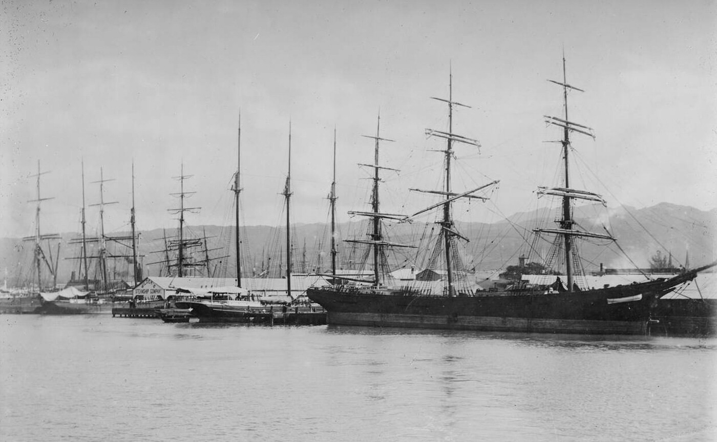#31 Sailing vessels docked at the wharf in Honolulu Harbor, 1890s.