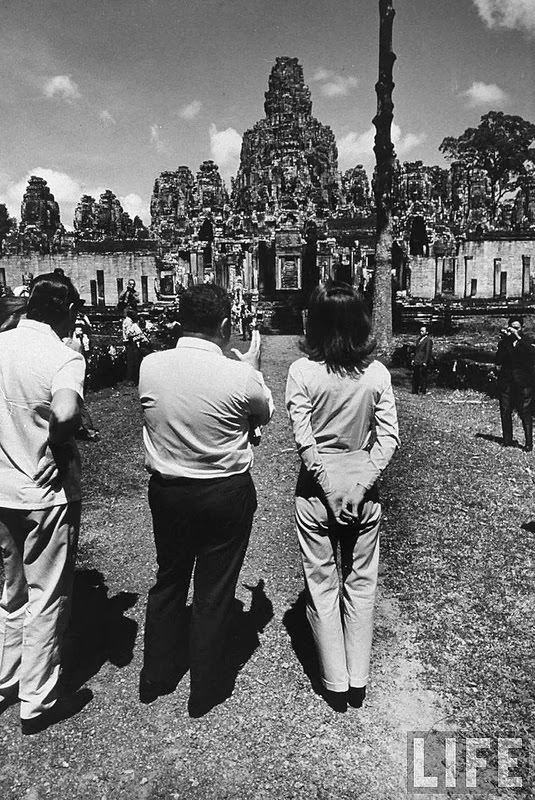 #4 Jackie Kennedy and David Ormsby-Gore visiting the Temple of Bayon, near the Angkor Wat. 1967