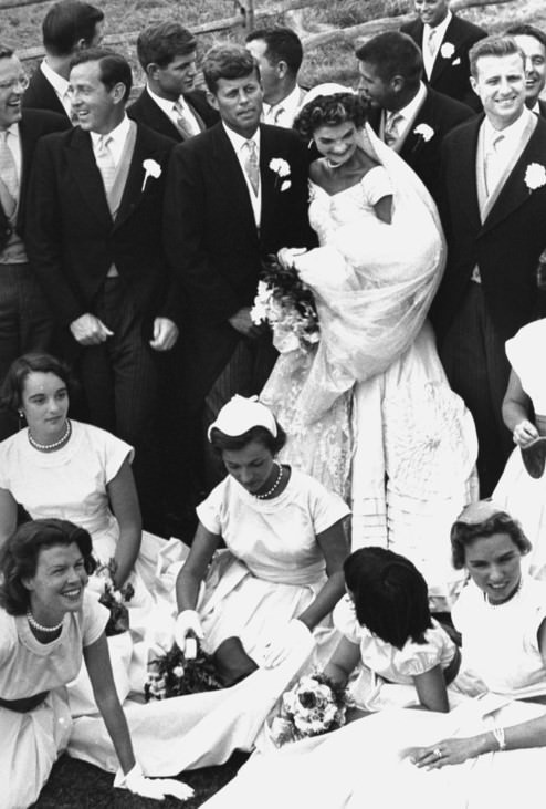 #16 Senator John Kennedy and his bride Jacqueline with ushers, bridesmaids, and flower girls at their wedding, 1953.
