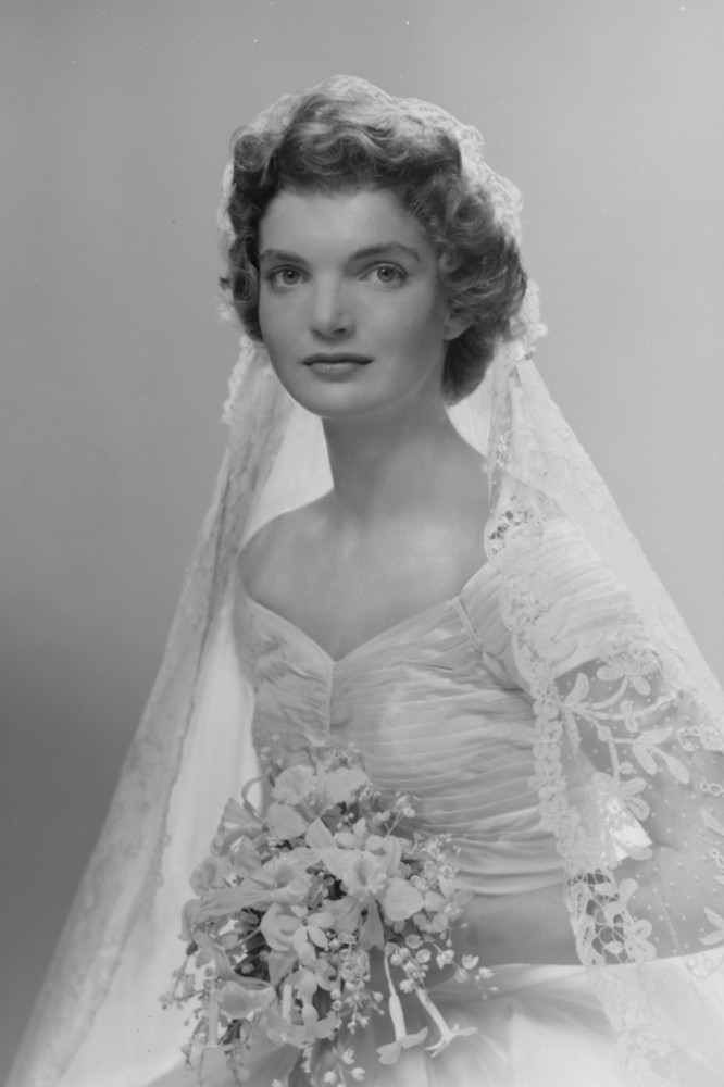 #5 Bridal portrait of Jacqueline Lee Bouvier in her wedding dress, New York, 1953.