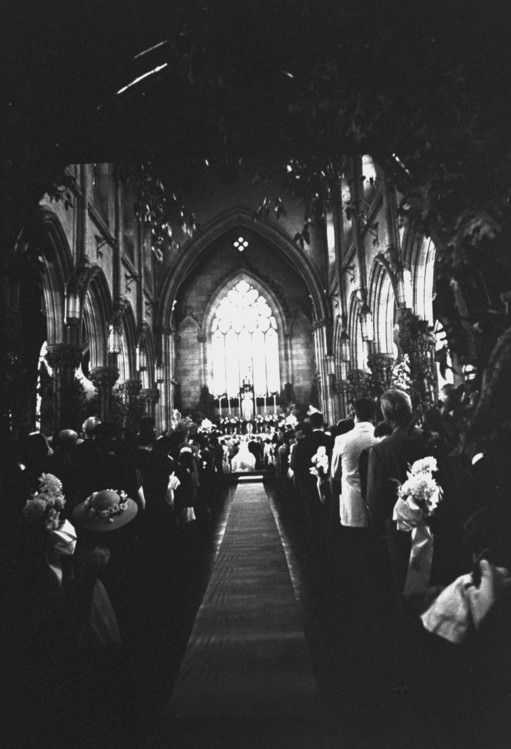 #8 Guests listen to the wedding vows of Senator John F. Kennedy and Jacqueline Bouvier, 1953.