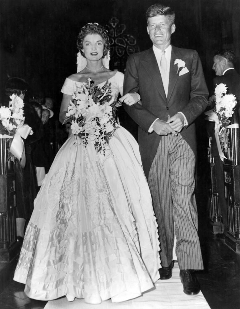 #9 Senator John F. Kennedy escorts his bride Jacqueline Lee Bouvier down the aisle at their wedding in Newport, Rhode Island, 1953.