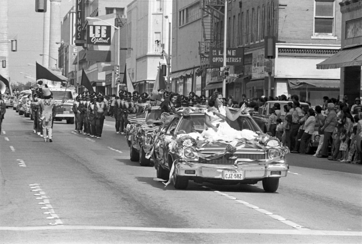 #5 Two candidates for the Mexican Independence Day Fiesta Queen wave to the crowd from cars in Fort Worth, Texas, 1977.
