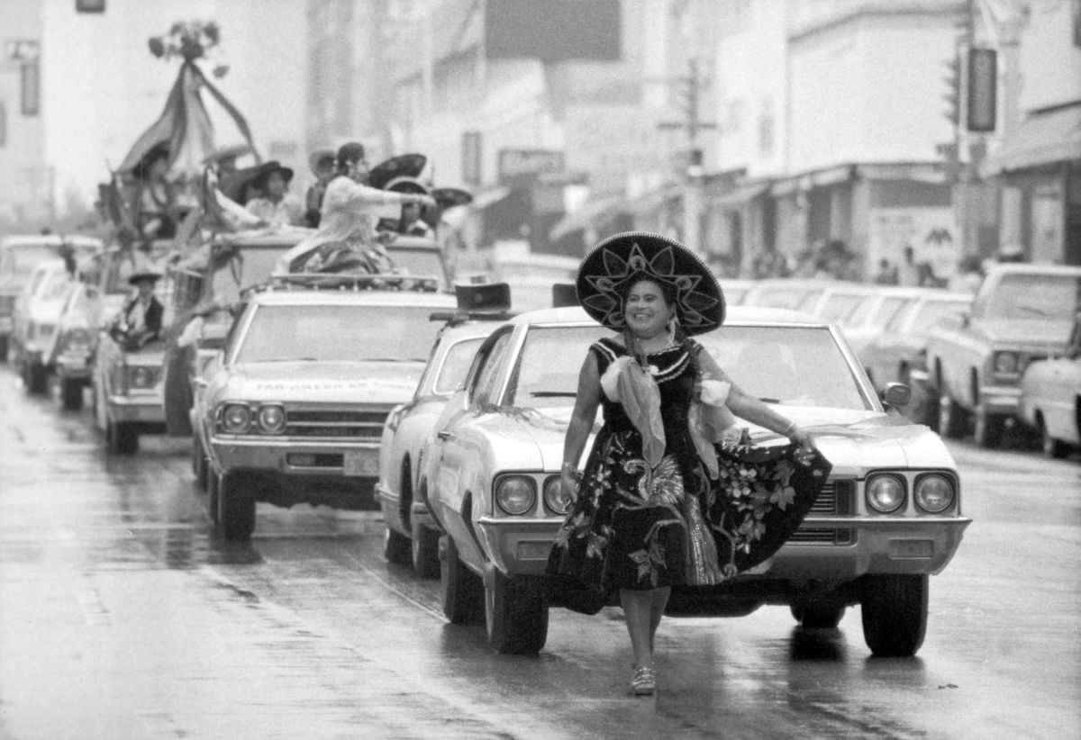 #7 A participant in traditional Mexican attire walks in the Mexican Independence Day parade in Fort Worth, Texas, 1974.