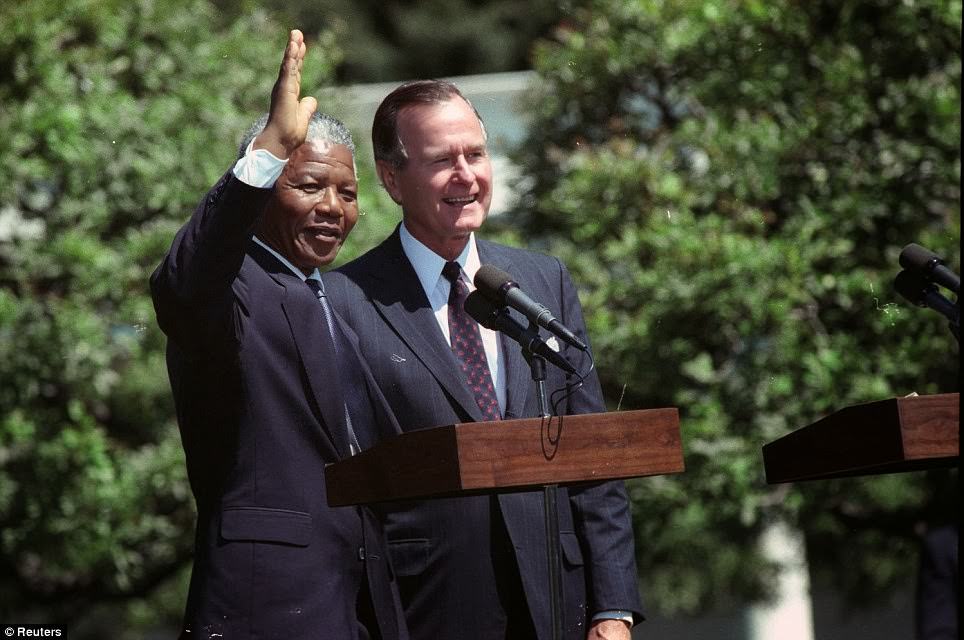 #12 African National Congress leader Nelson Mandela waves after he and U.S. President George Bush made remarks on the South Lawn of the White House June 25, 1990 – the support of the US public was key in securing his release.