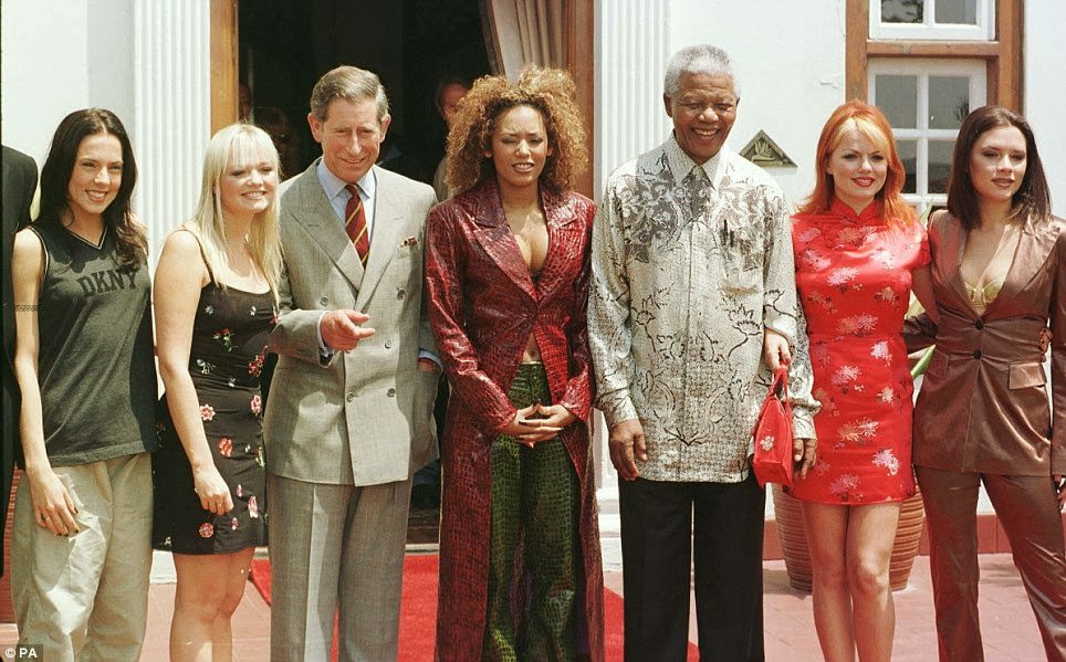 #23 Prince of Wales (left) and South African President Nelson Mandela at a photocall with the Spice Girls (left to right), Mel C, Emma, Mel B, Geri and Victoria at the presidential residence Mahlamba Nalopfu in Pretoria in 1997.