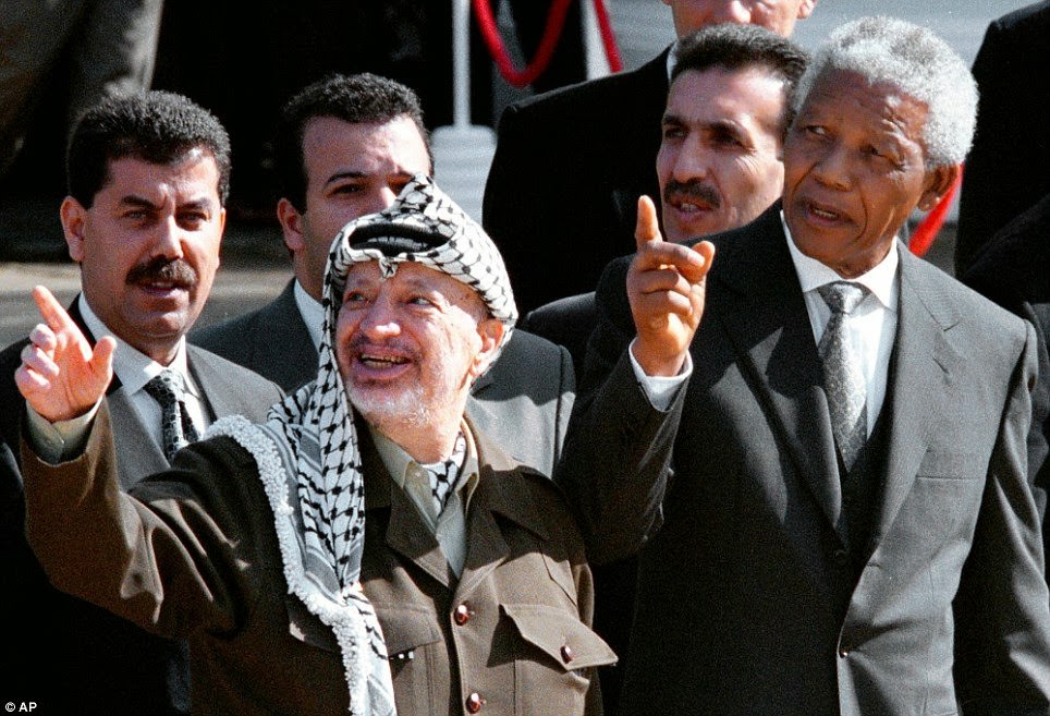 #25 In this Aug. 11, 1998 file photo, South African President Nelson Mandela, (right), and Palestinian leader Yasser Arafat gesture during a meeting in Cape Town, South Africa.