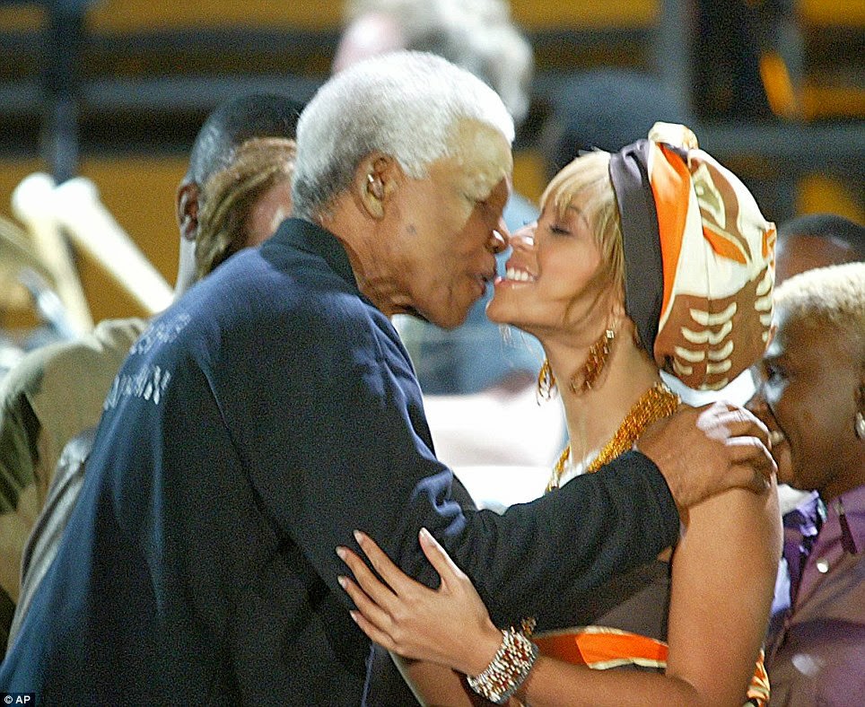 #5 Former South African President Nelson Mandela kisses U.S. singer Beyonce Knowles, at the Nelson Mandela AIDS Benefit Concert in Cape Town, South Africa Saturday Nov. 29, 2003.