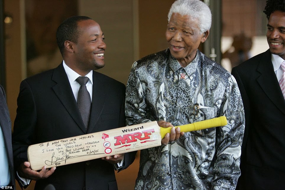 #8 West Indian cricket star, Brian Lara (L) meetings with Nobel Peace Prize winner and iconic political prisoner Nelson Mandela (R) at the Nelson Mandela Foundation, Johannesburg, South Africa in 2005.