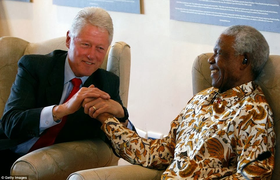 #9 Former U.S. President Bill Clinton (L) embraces former South African President Nelson Mandela following remarks by Clinton during a visit to the Nelson Mandela Foundation July 19, 2007 in Johannesburg.