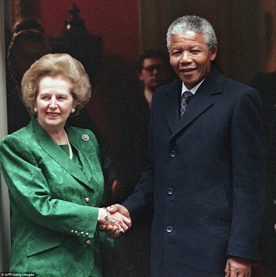 South African anti-apartheid leader and African National Congress (ANC) member Nelson Mandela (R) shaking hands with British Prime Minister Margaret Thatcher on the steps of No 10 Downing Street in July 1990.