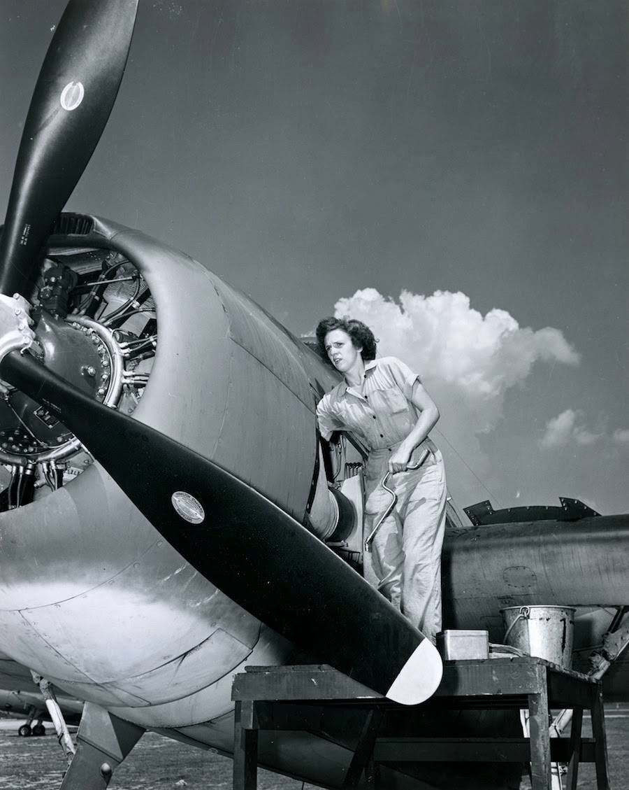 #14 A WAVES aviation machinist, members received military ranks and benefits and were paid the same as Navy men, 1940s.