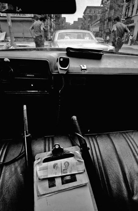 #15 Two officers check a suspicious car with their hands on their revolver handles, 1978.